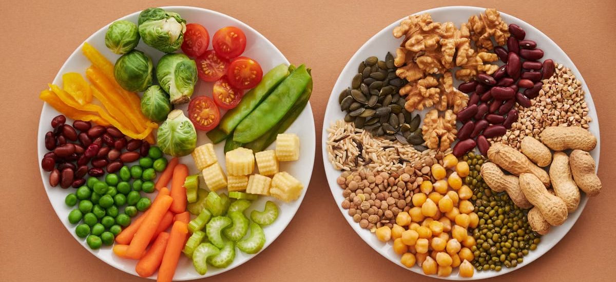 A vibrant flatlay of colorful vegetables and nuts showcasing a balanced diet concept.